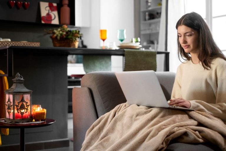 vacation-rent-medium-shot-woman-working-laptop